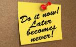 A note pinned to a cork board with the text Do It Now! Later Becomes Never!
